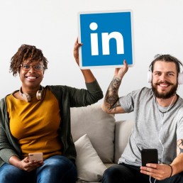 people holding linkedin logo man and woman